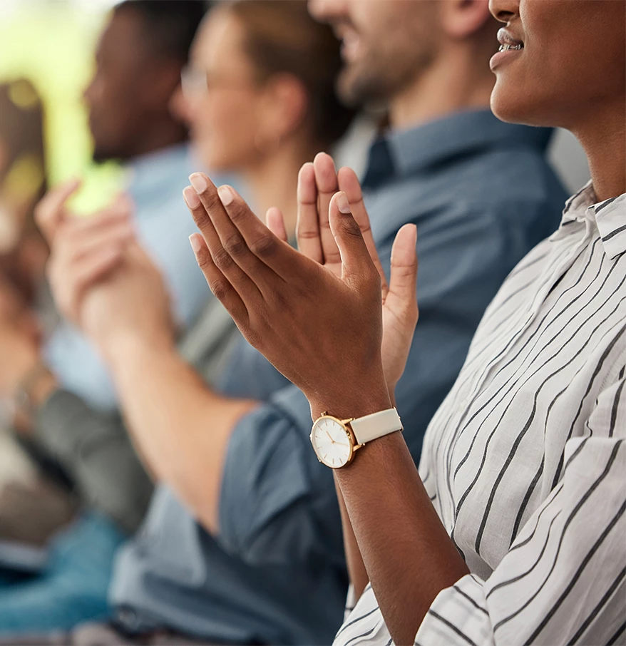 a group of people clapping