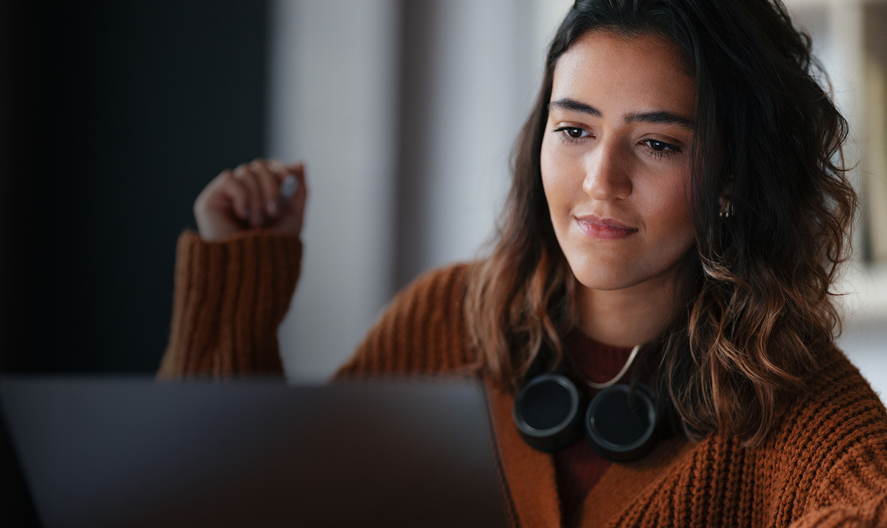 a woman looking at a laptop