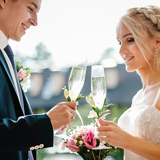a man and woman holding flowers
