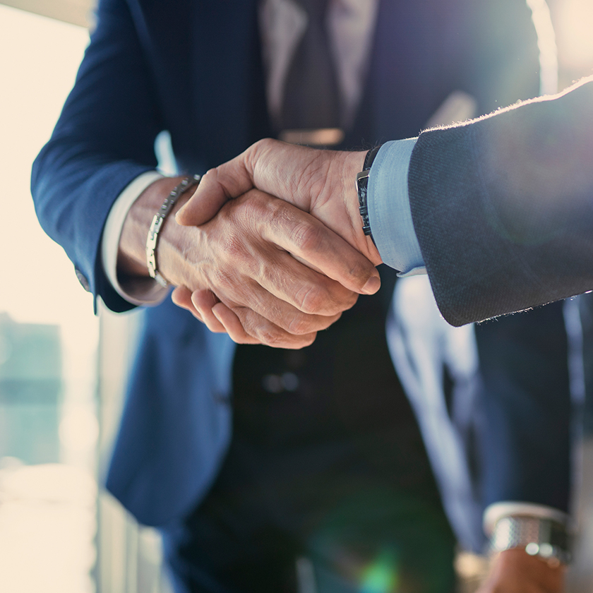 close-up of people shaking hands