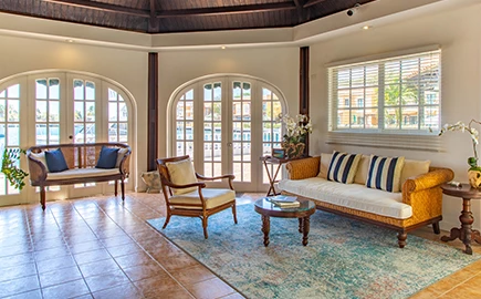 a room with a couch and chairs