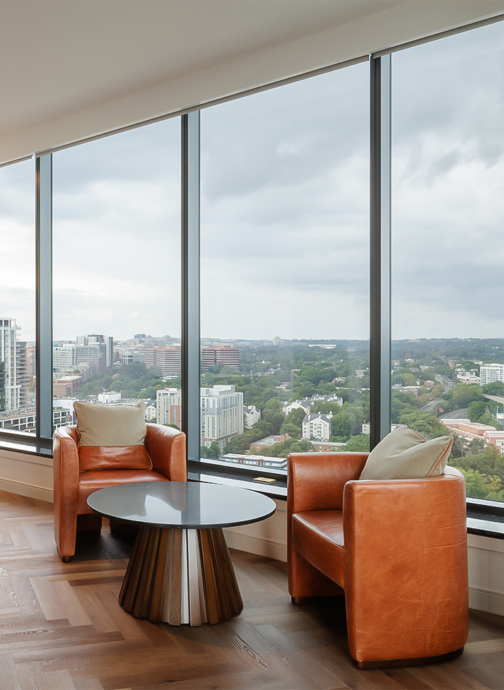 a room with a large window overlooking a city