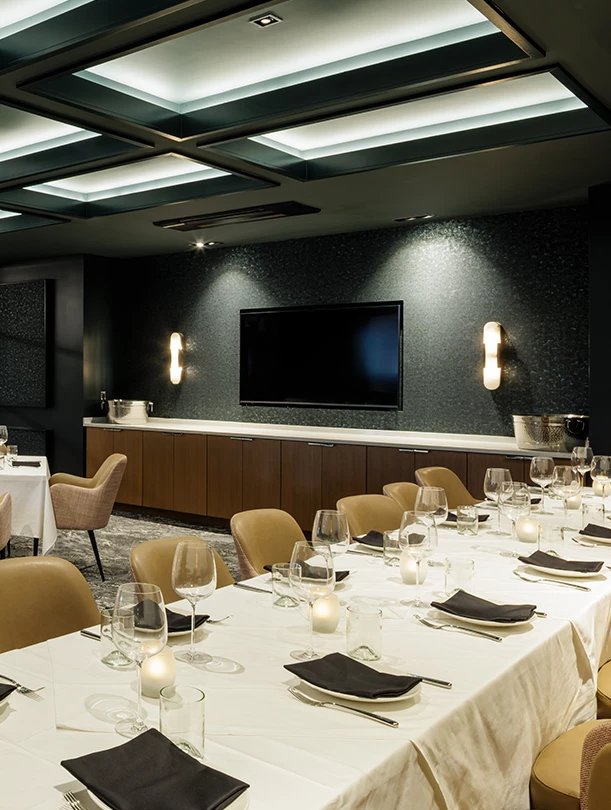 a room with a large table set for dinner