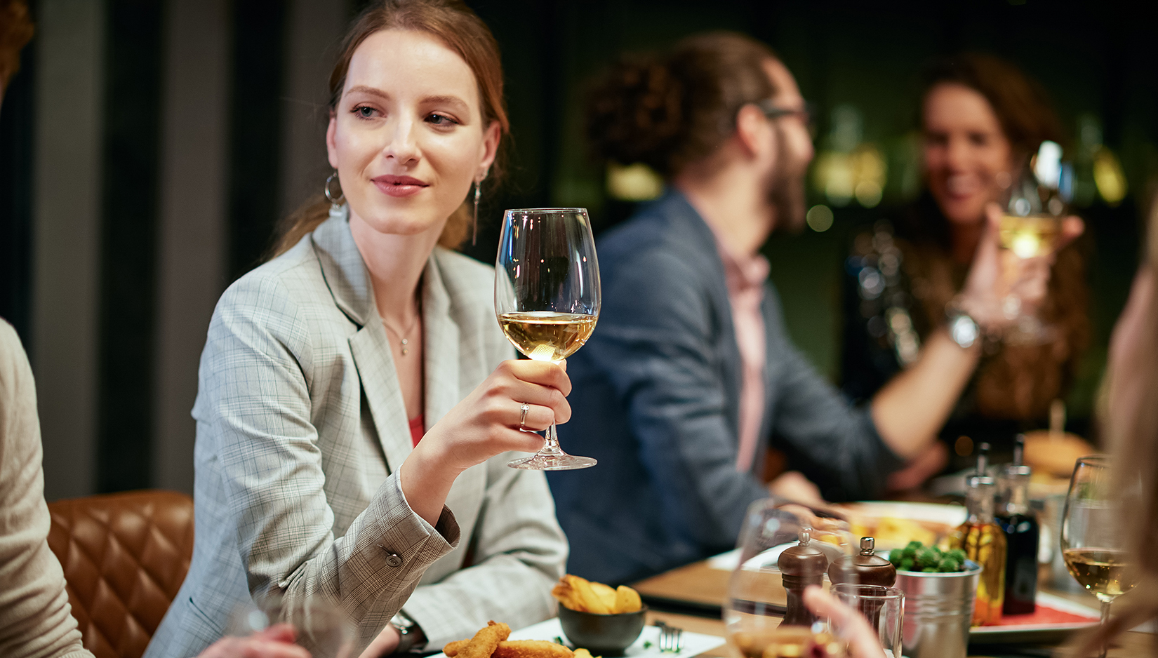 a woman holding a wine glass