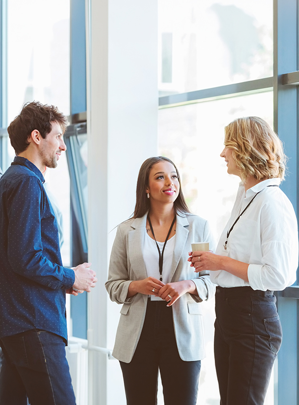 a group of people talking in a room