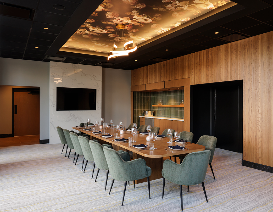 a large conference room with a long table and chairs