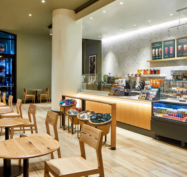 a coffee shop with tables and chairs