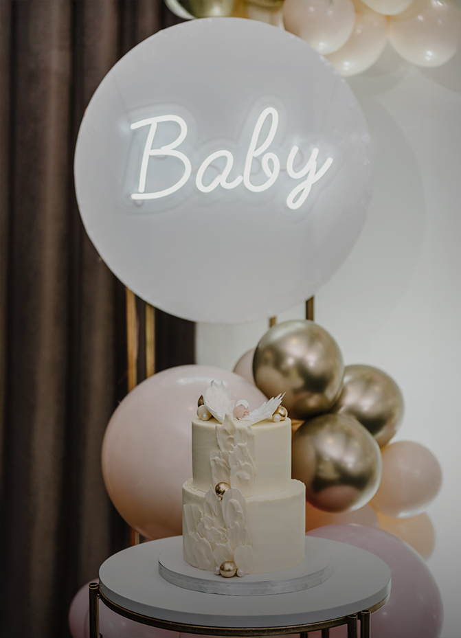 a cake with a balloon in the background