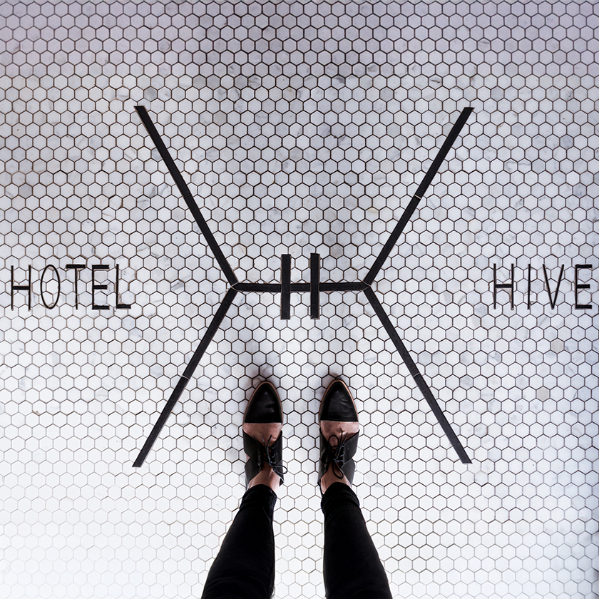 a person standing on a tile floor