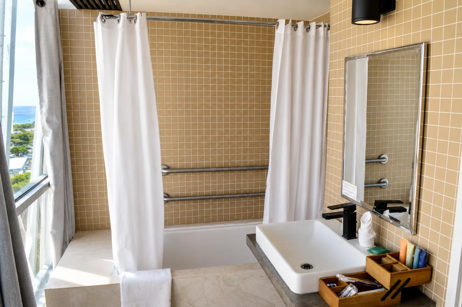 A bathroom with a bathtub, shower, sink, and mirror.