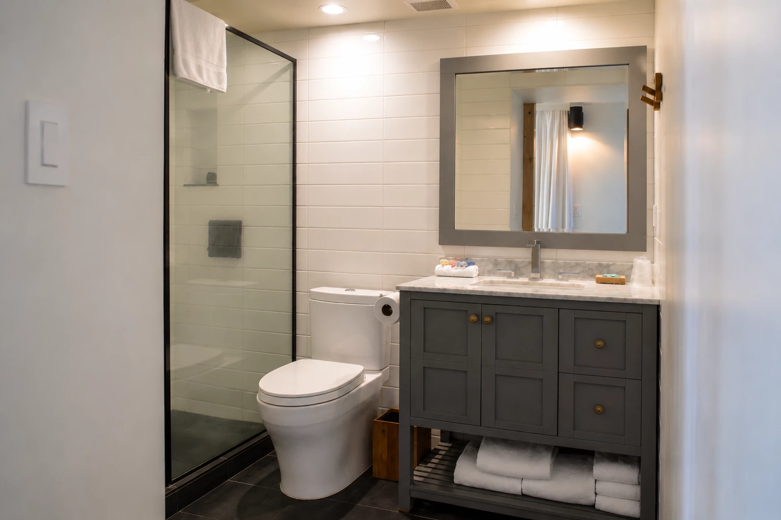 A clean bathroom with a shower, toilet, and sink