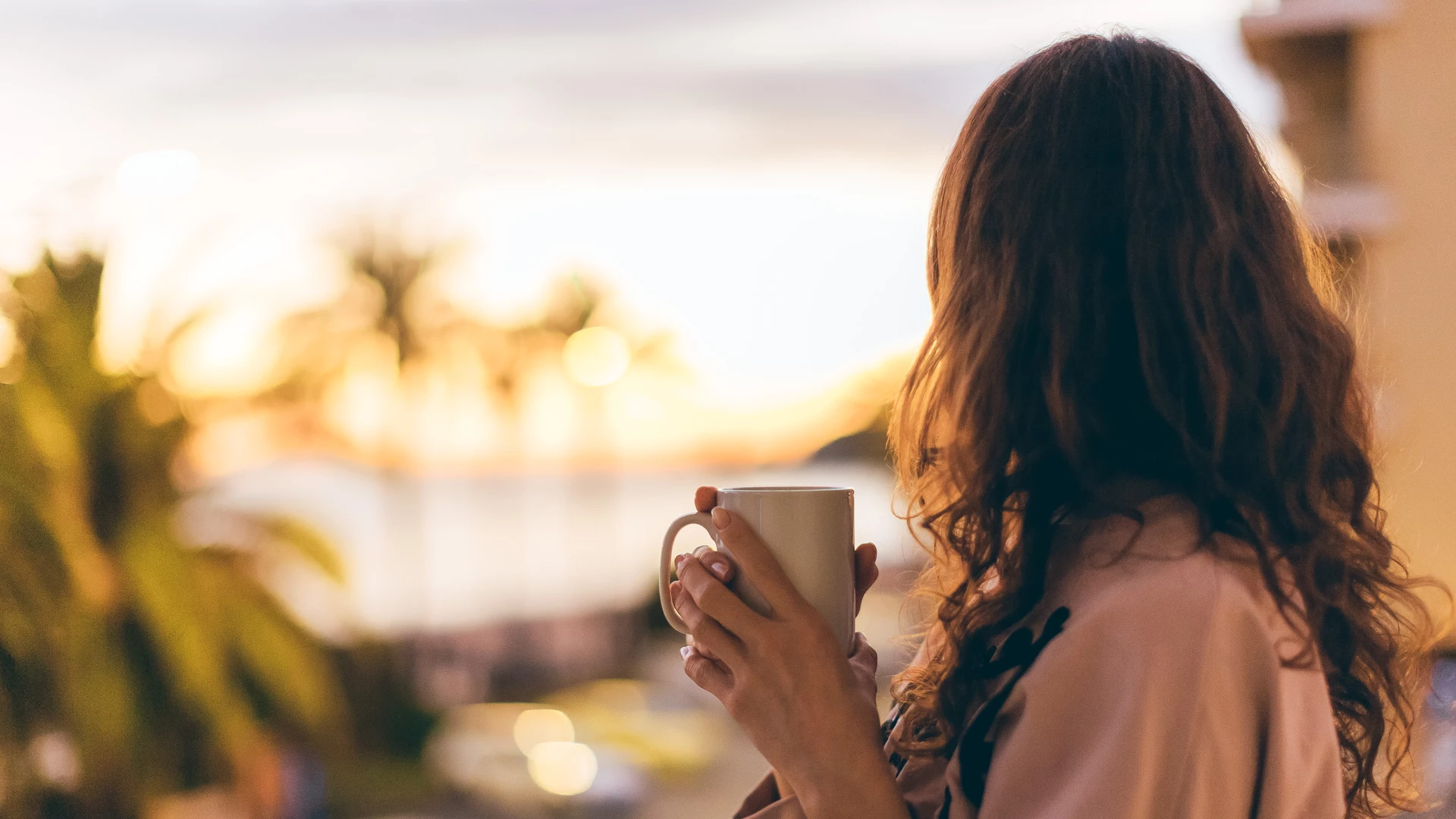 a woman holding a cup