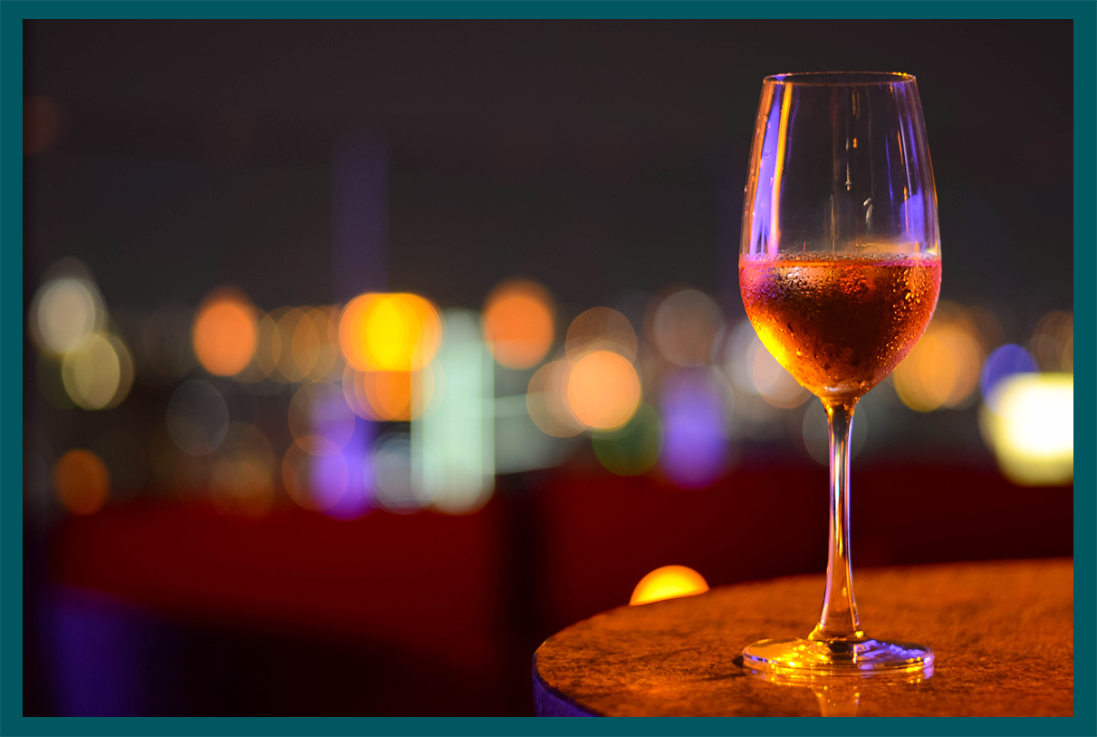 a glass of wine on a table