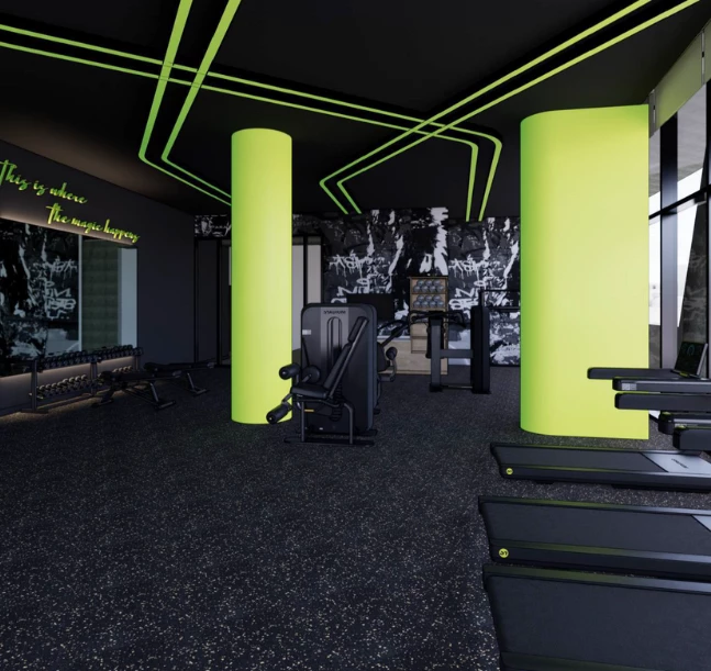 a gym with green columns and black floor
