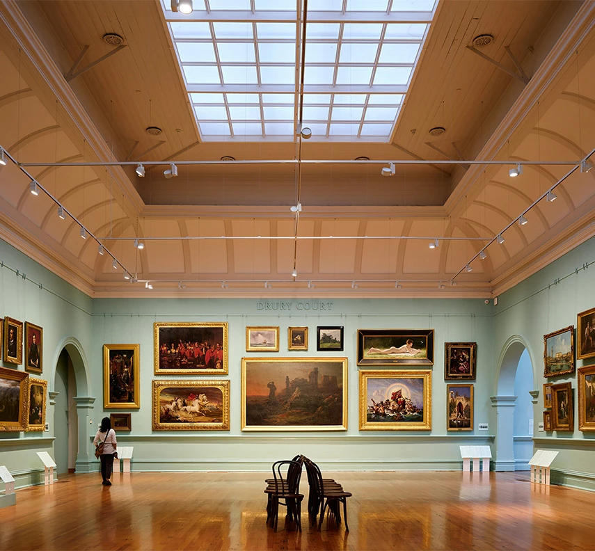 a room with paintings on the wall