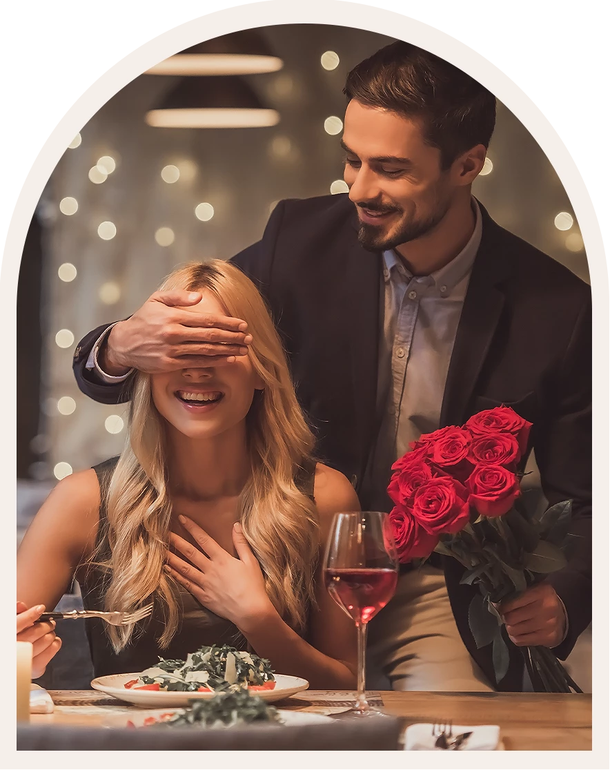 a man covering his eyes with his hand and a woman with flowers