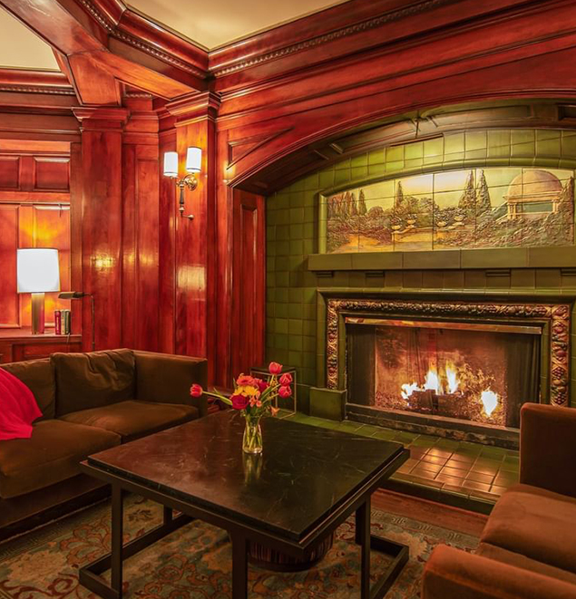 a room with a fireplace and couches