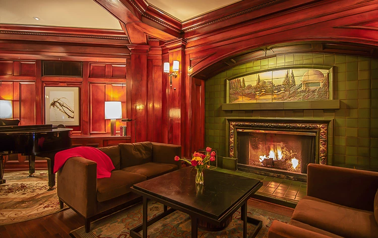 a room with a fireplace and couches