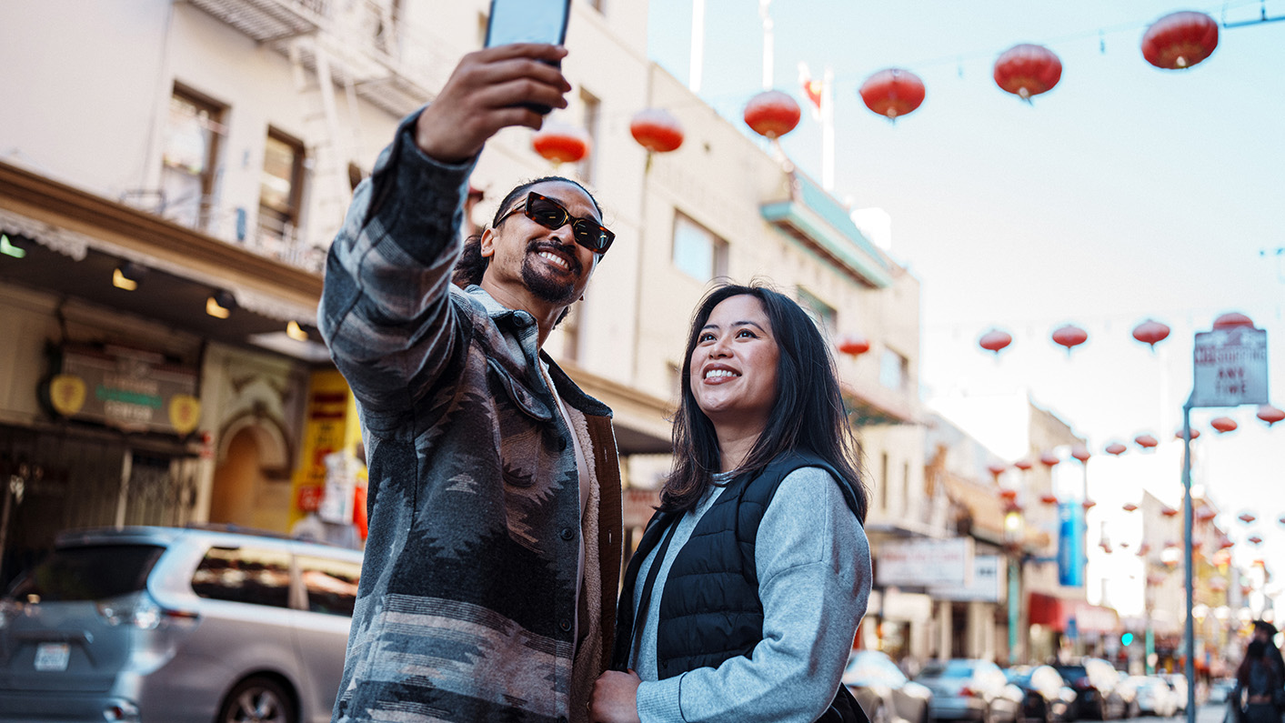 a man and woman taking a selfie
