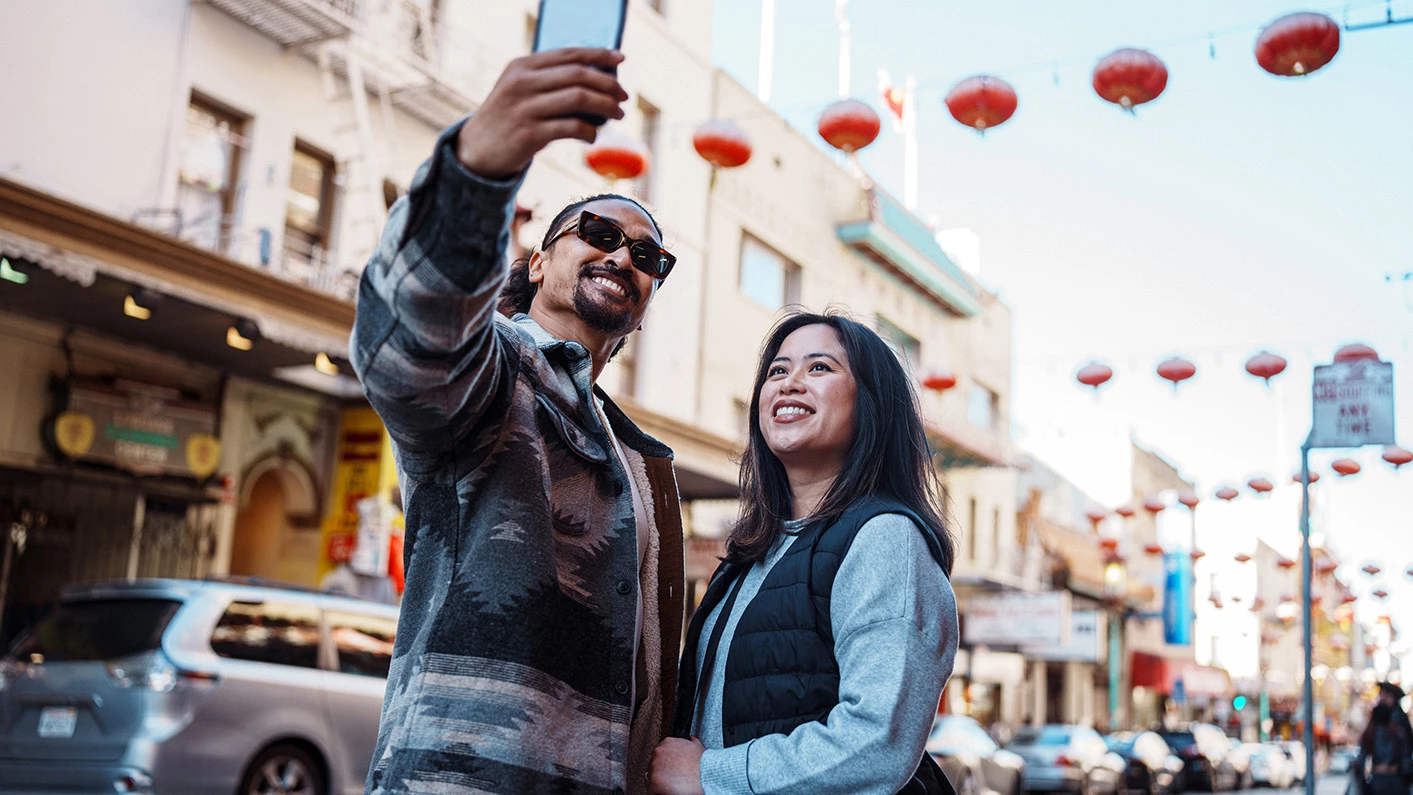 a man and woman taking a selfie