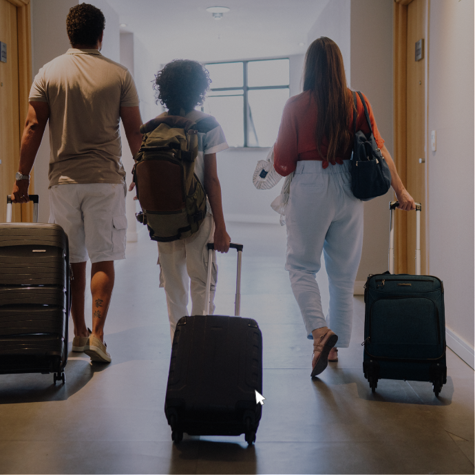 a group of people walking with luggage