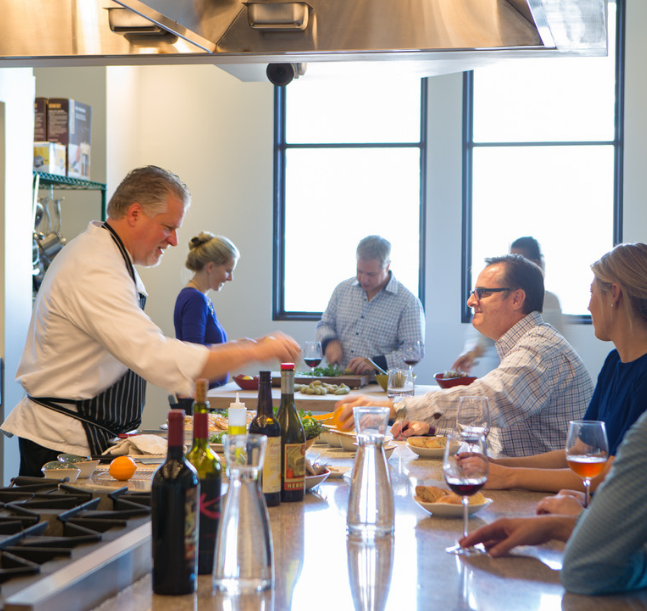a group of people eating and drinking