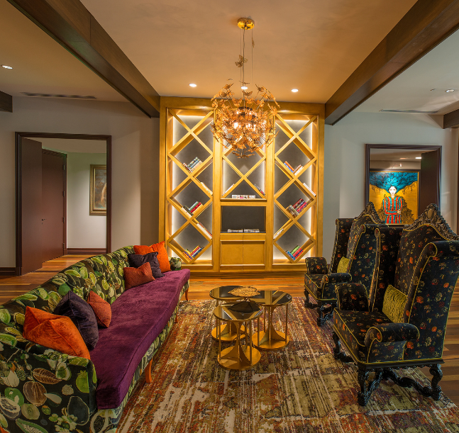 a living room with a couch and chairs