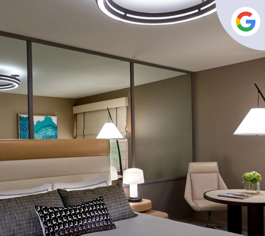 a bedroom with a round table and chairs