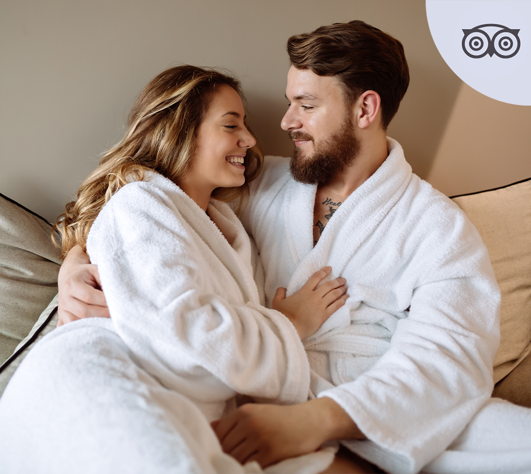 a man and woman in bathrobes