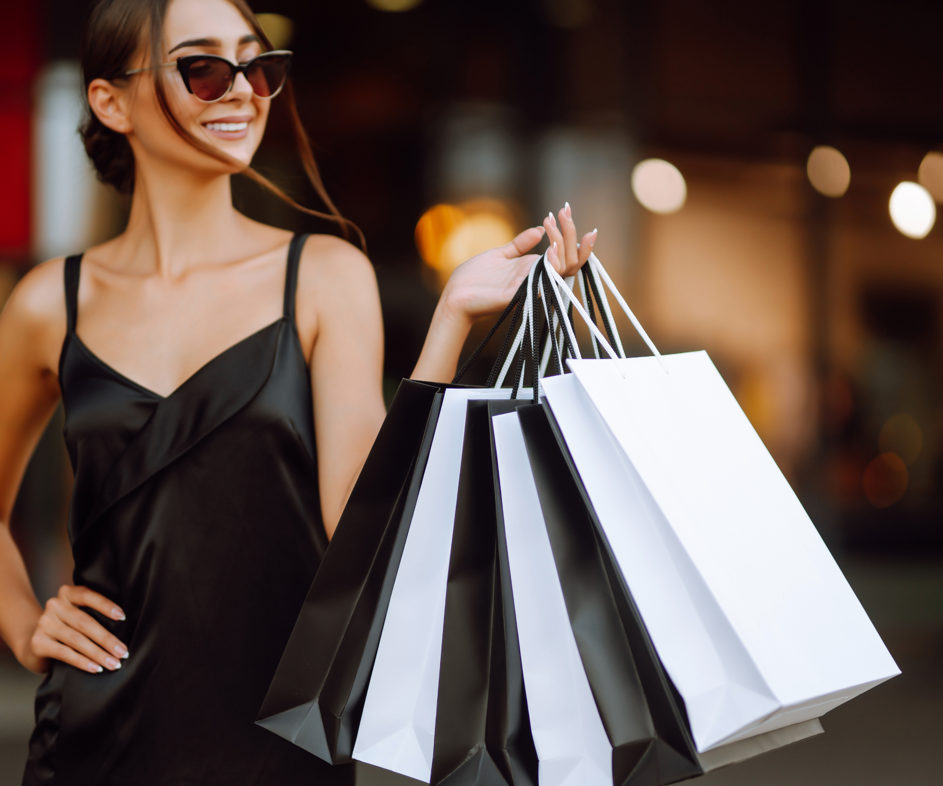 a woman holding shopping bags