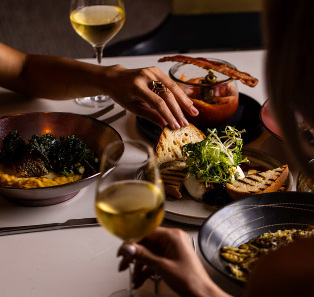a person eating food at a table