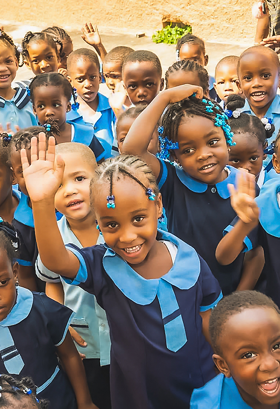 a group of children in school uniforms