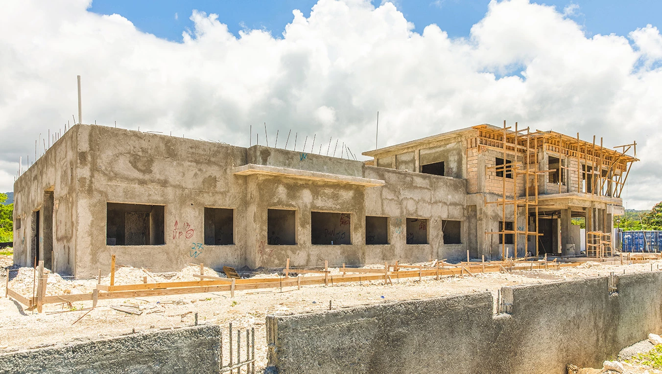 a building under construction with a concrete wall