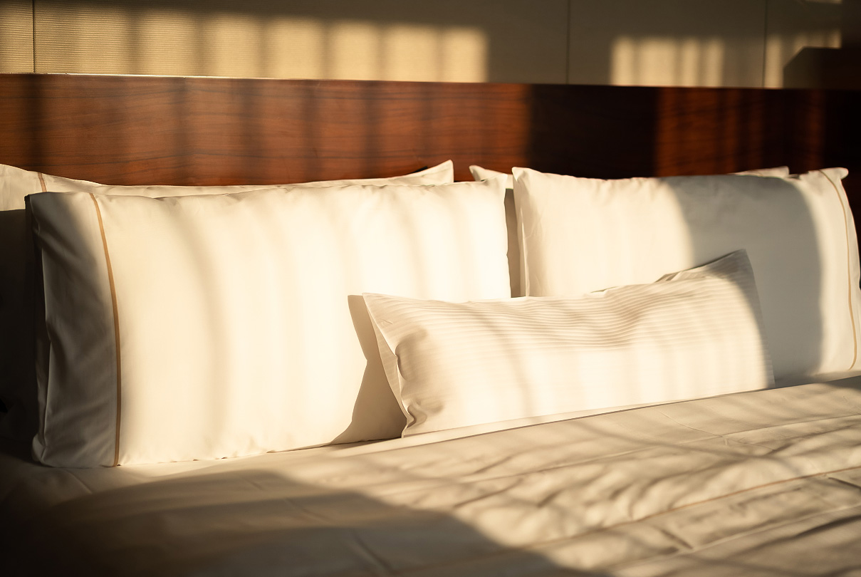 a bed with white pillows