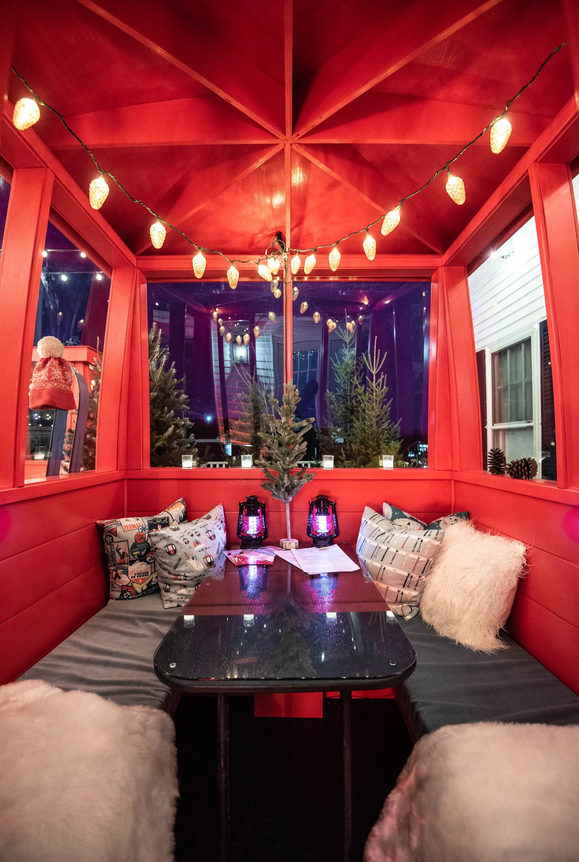 a red room with a table and a table with lights