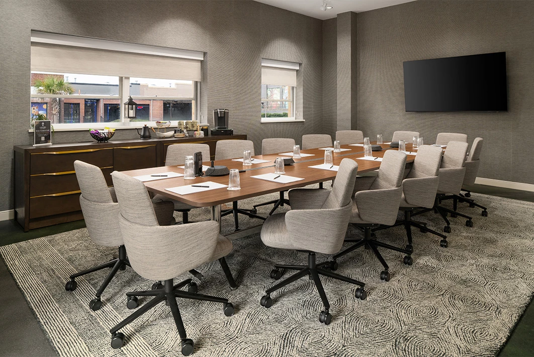 a conference room with a table and chairs