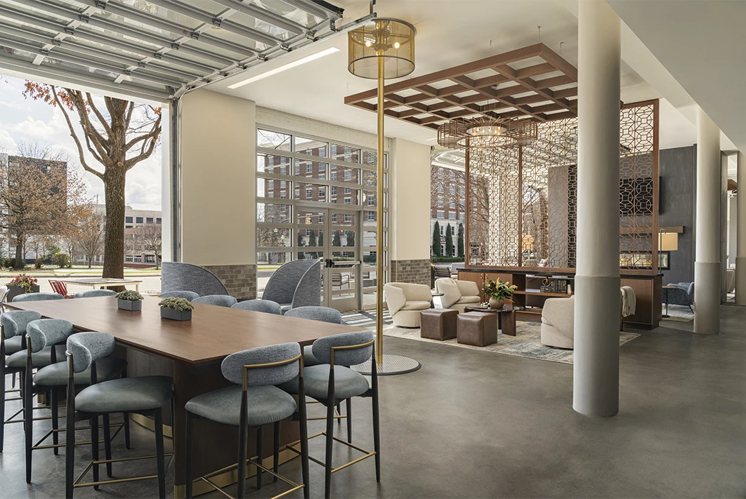 a room with a large table and chairs