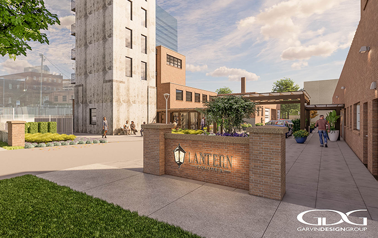 a brick wall with a sign in front of a building