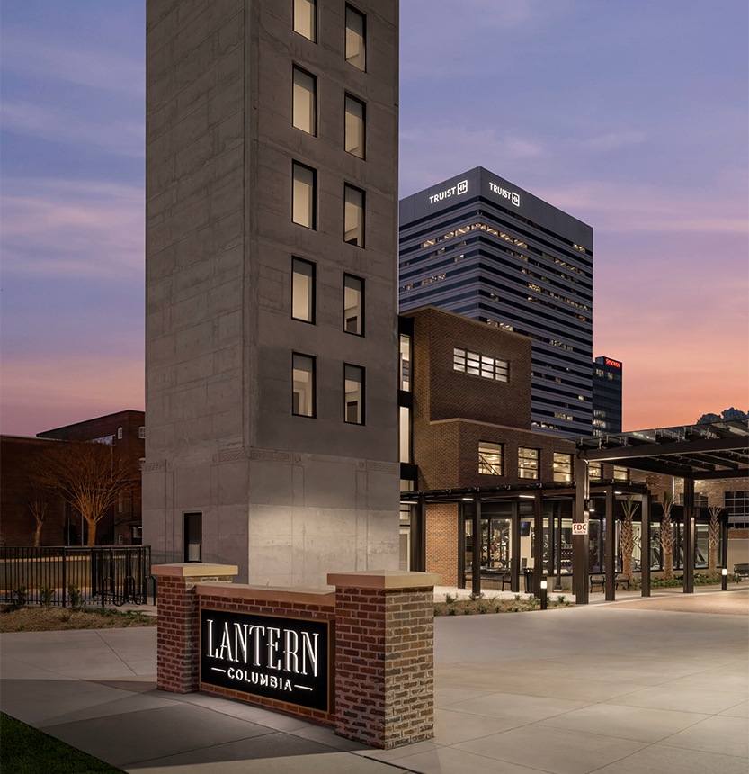 a tall building with a sign in front of it