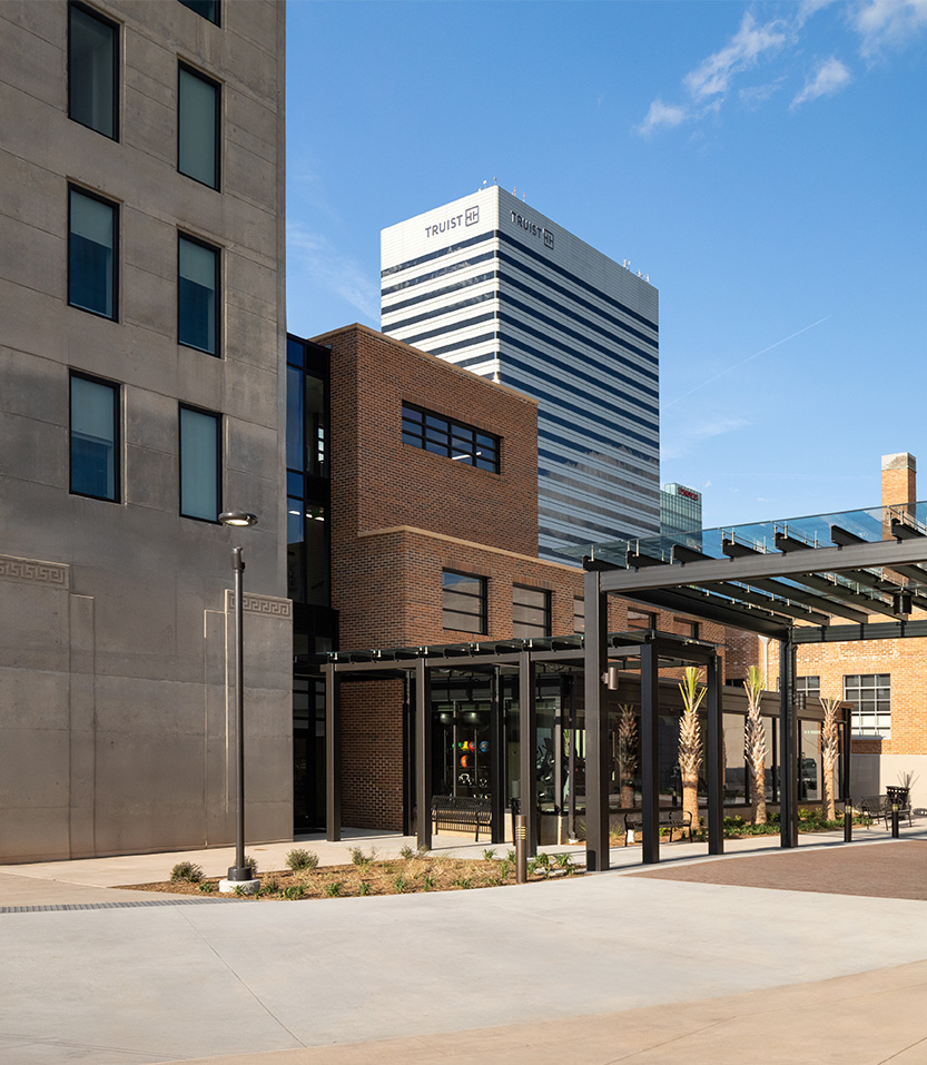 a building with a pergola and a walkway