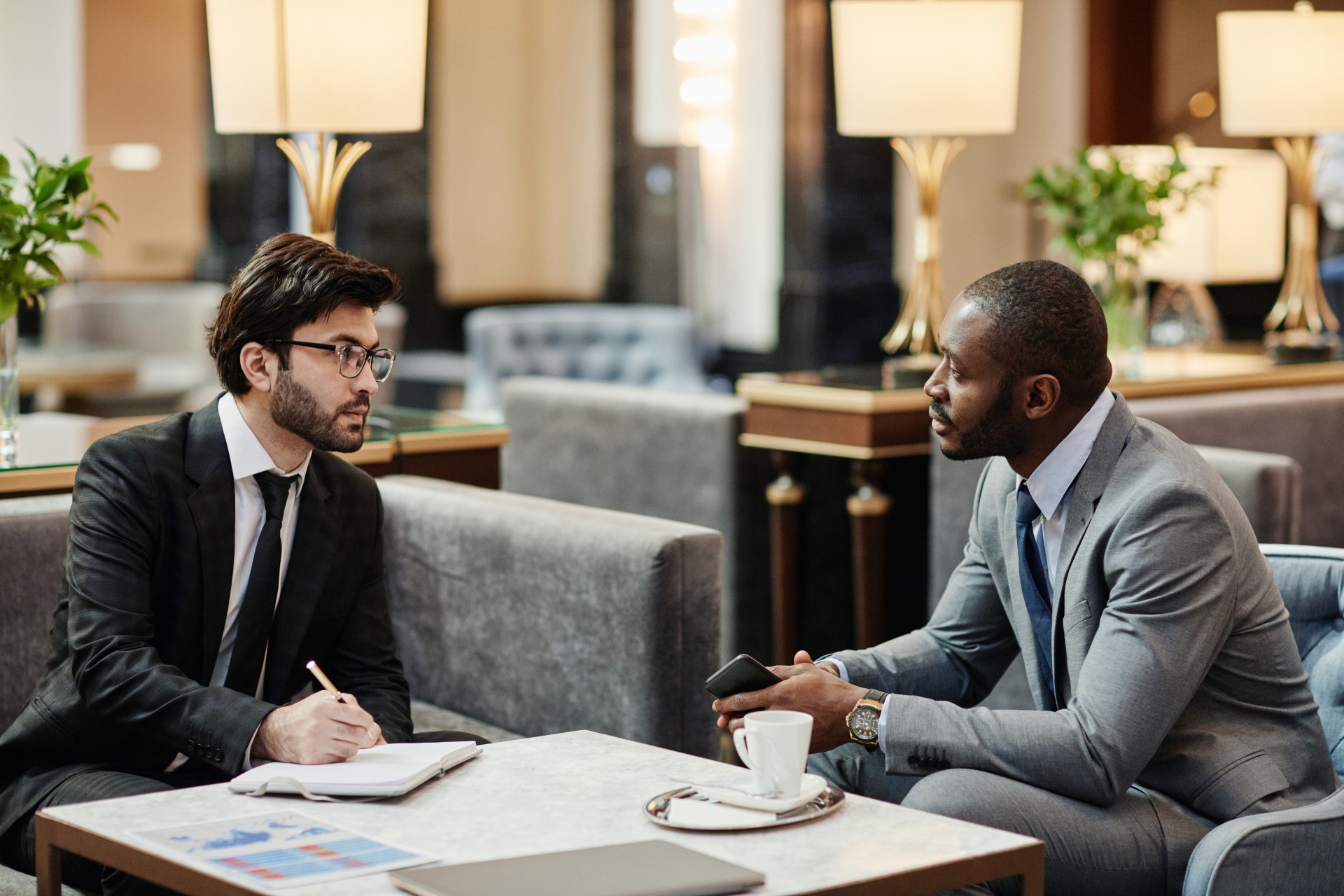 two men sitting at a table