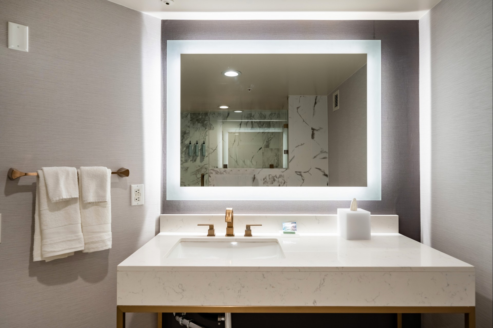 a bathroom with a mirror and a sink