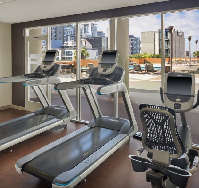 a room with treadmills and exercise equipment