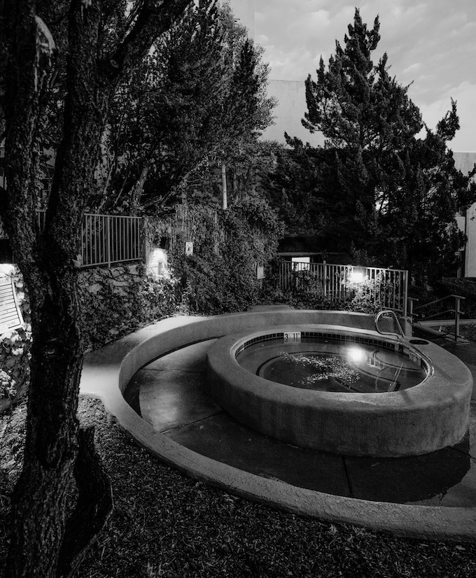 a hot tub in a courtyard