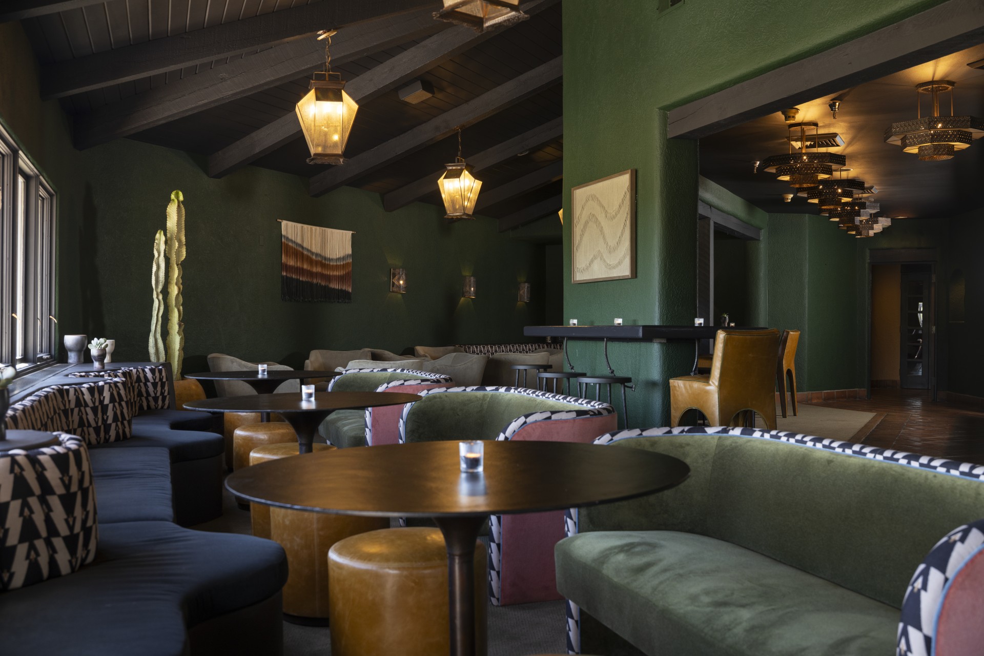 a room with green walls and a green wall with a green wall and a green couch and a green wall with a green wall and a green wall with a green wall and a green wall with a