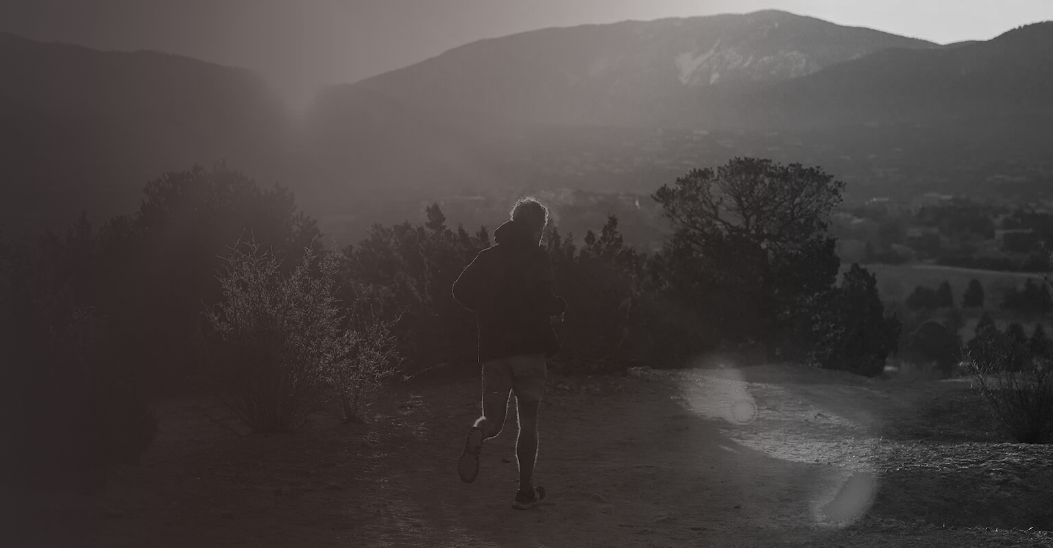 a person running on a dirt path