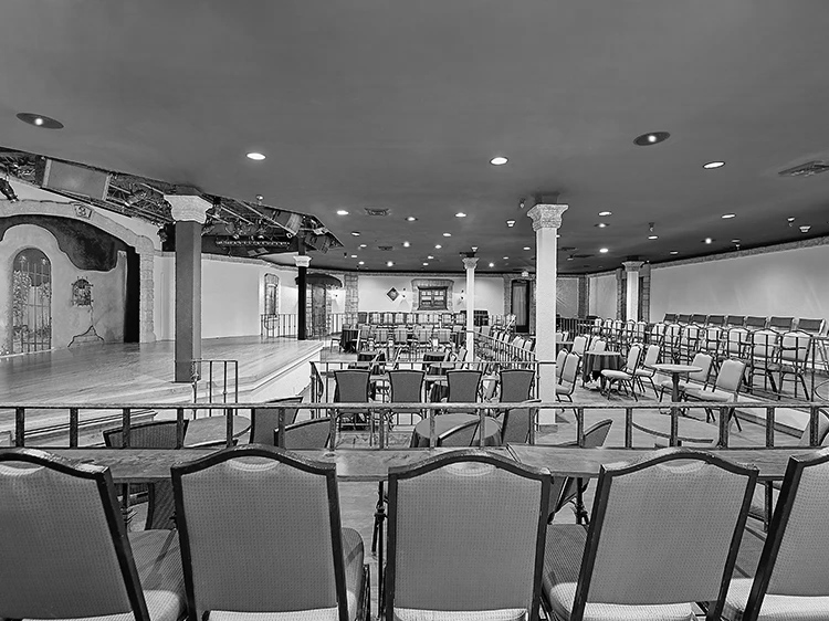 a room with chairs and a stage