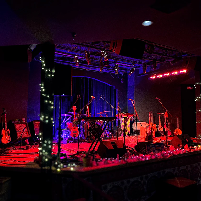 a stage with musical instruments and lights