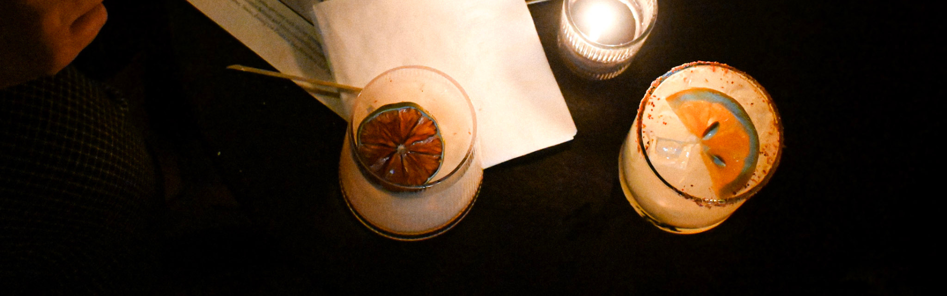 a glass with a slice of lemon on it