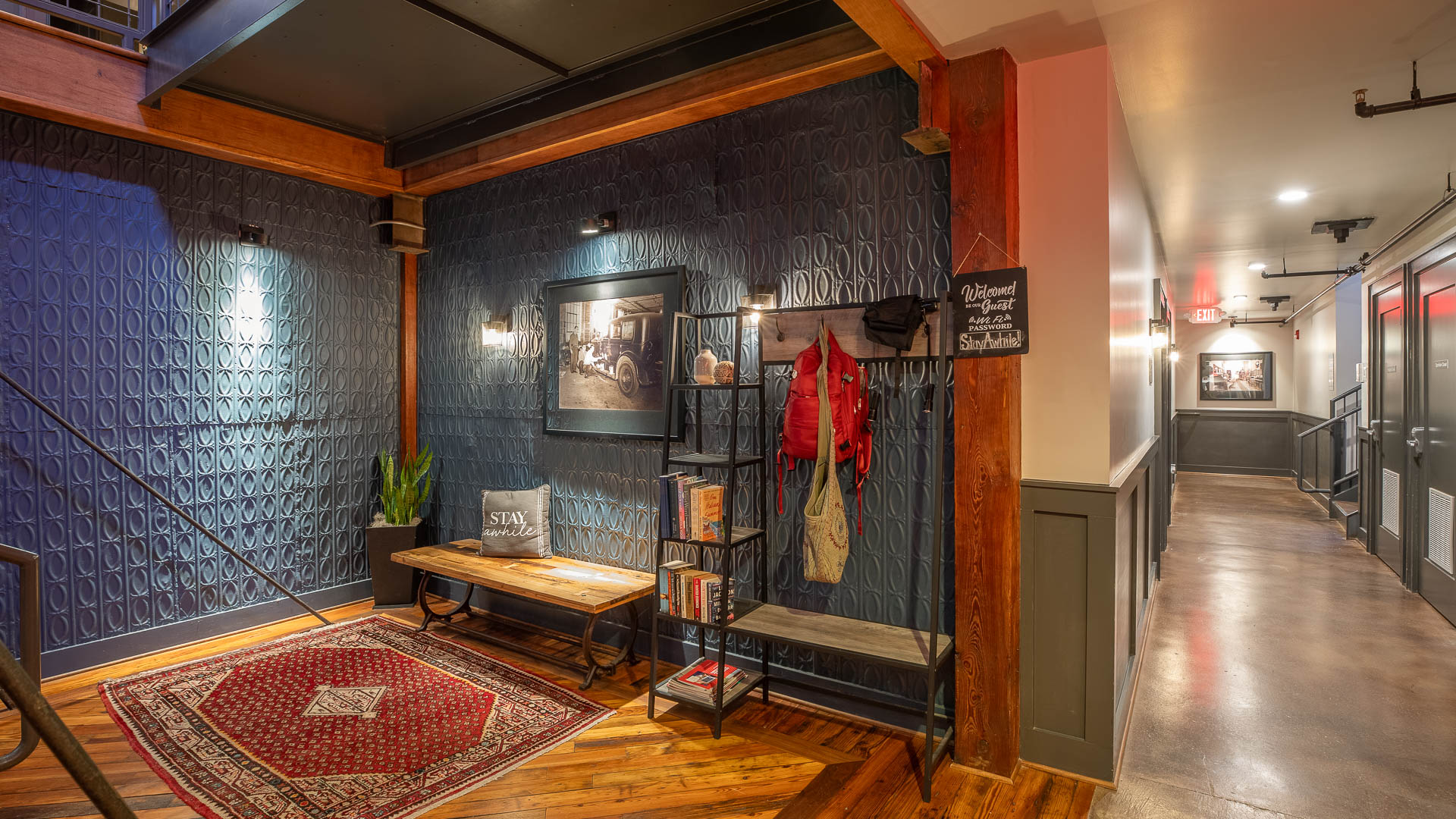 a room with a bench and a coat rack